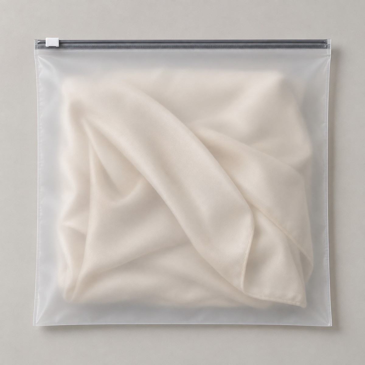 Frosted inner bag with slider zipper.